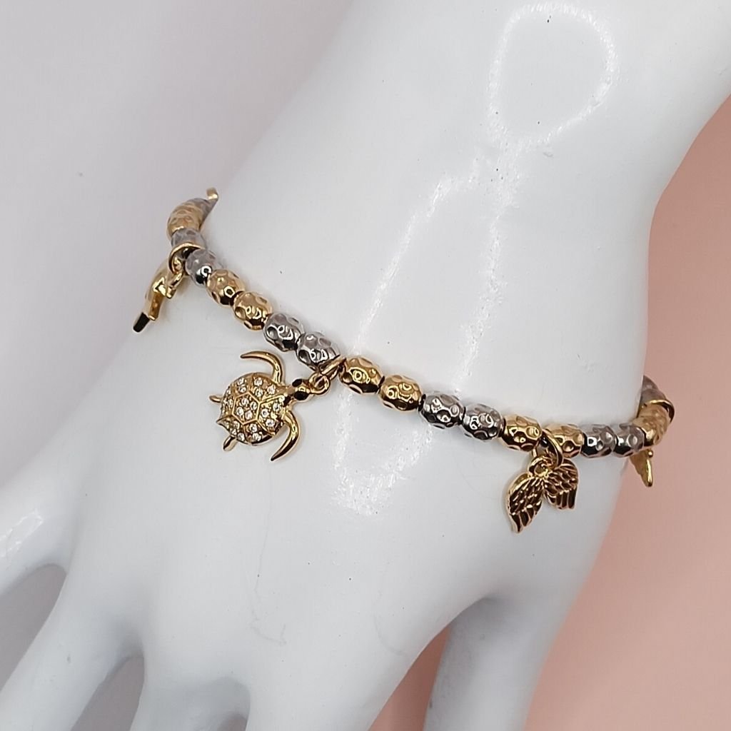 Δίχρωμο βραχιόλι με χελώνα & φτερά σε χρυσό-ασημί